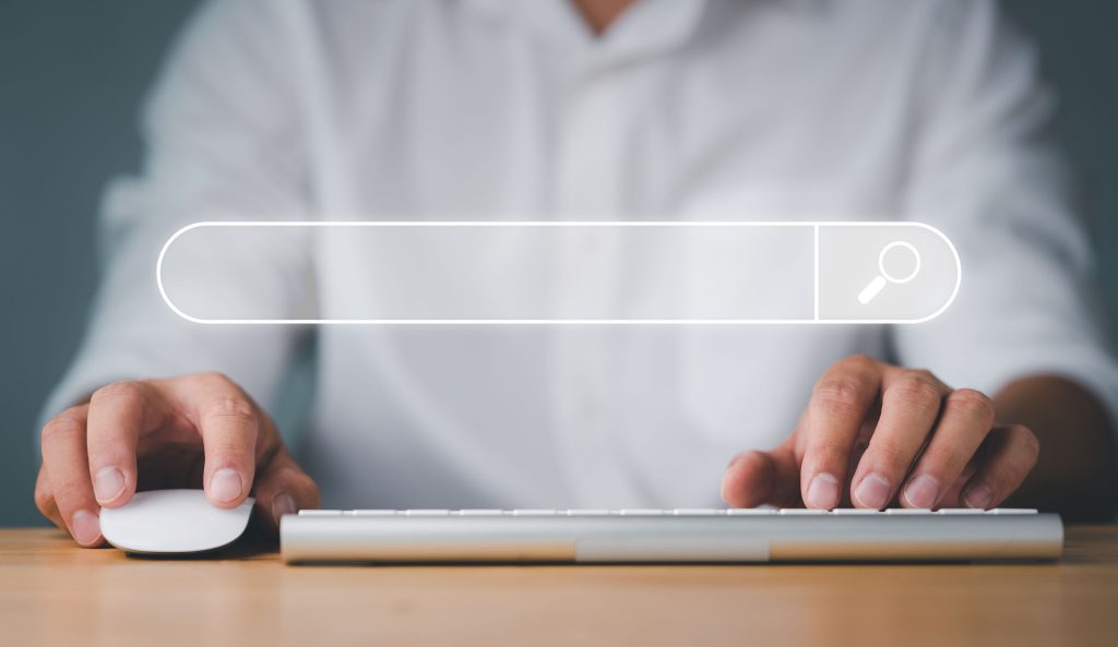 Man using a computer to optimize a website for search